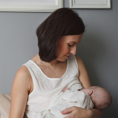 Thumbnail image of a woman holding a baby.