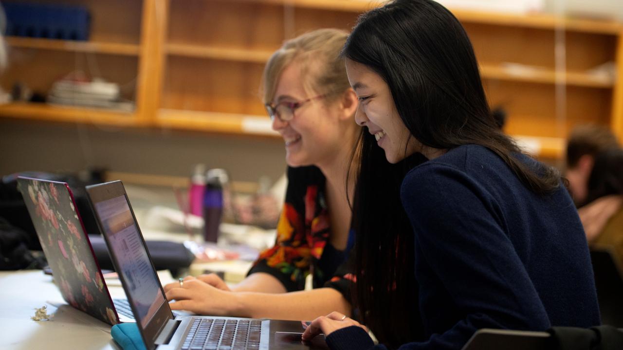 Students looking at a computer