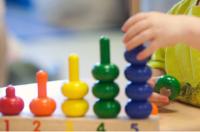 childs hands with toy