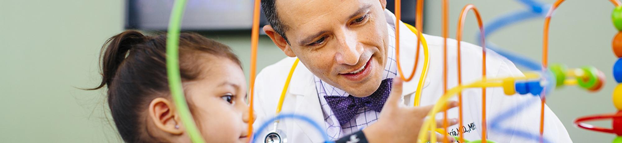 Doctor playing with pediatric patient