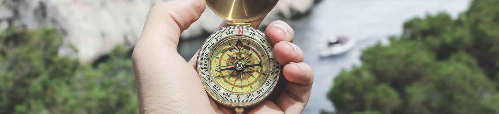 hand with compass